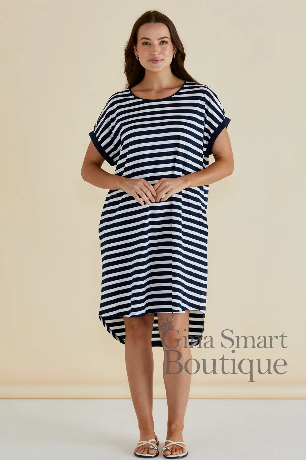 Betty Basics Maxine T-Shirt Dress is a navy and white horizontal striped t-shirt dress with a high-low hem - available at Gina Smart Boutique