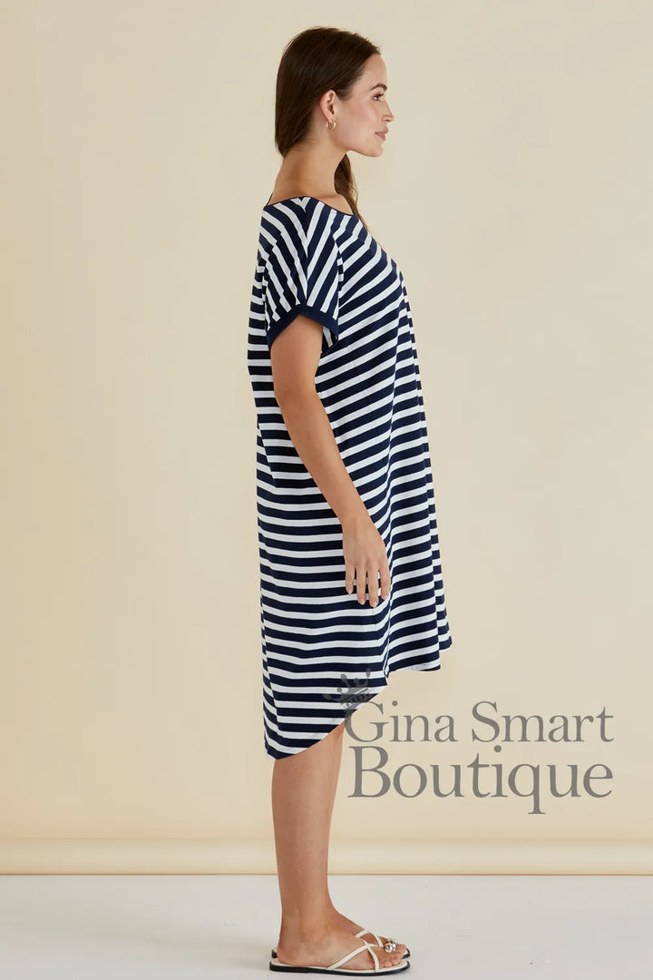 Betty Basics Maxine T-Shirt Dress side view is a navy and white horizontal striped t-shirt dress with a high-low hem - available at Gina Smart Boutique