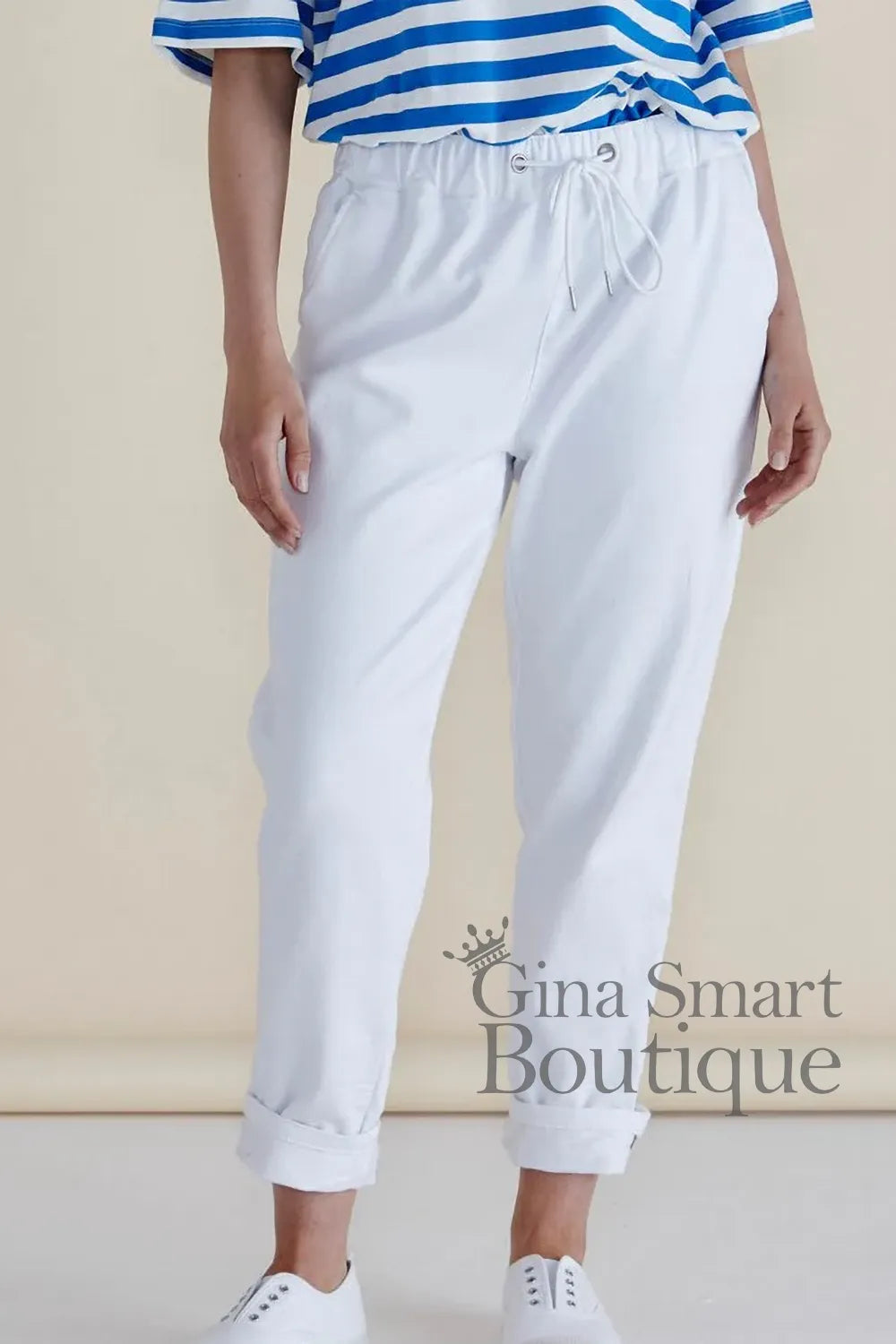 Betty Basics white drawstring trousers with a relaxed fit and cuffed hem available at Gina Smart Boutique