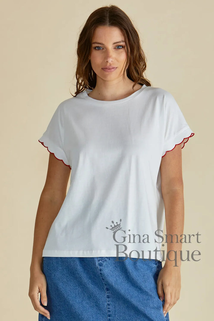 Betty Basics Sloane White Scallop Tee is a white crew neck t-shirt with red-trimmed scalloped sleeves.  Available at Gina Smart Boutique