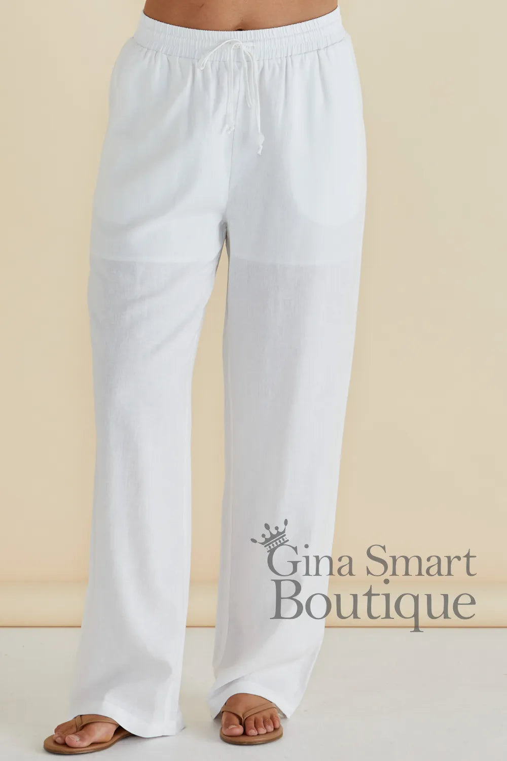Betty Basics Zaza Relaxed Trouser is a white wide leg trouser with a comfortable elastic waistband.  Available at Gina Smart Boutique