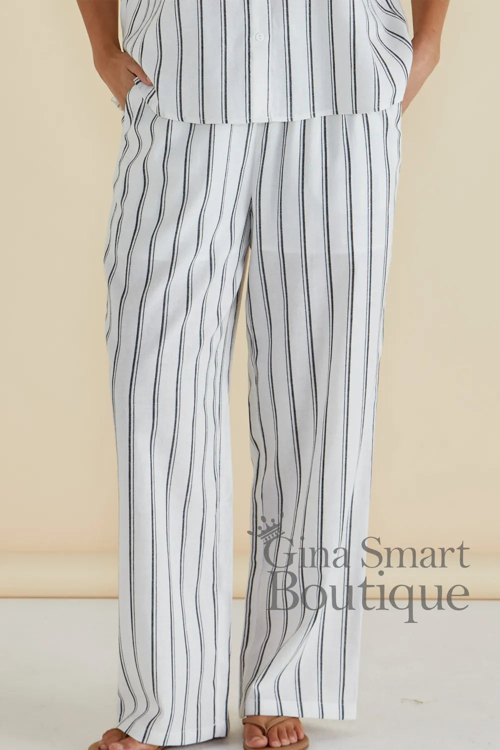 Betty Basics white striped wide leg trousers with an elastic waistband and side pockets - available at Gina Smart Boutique