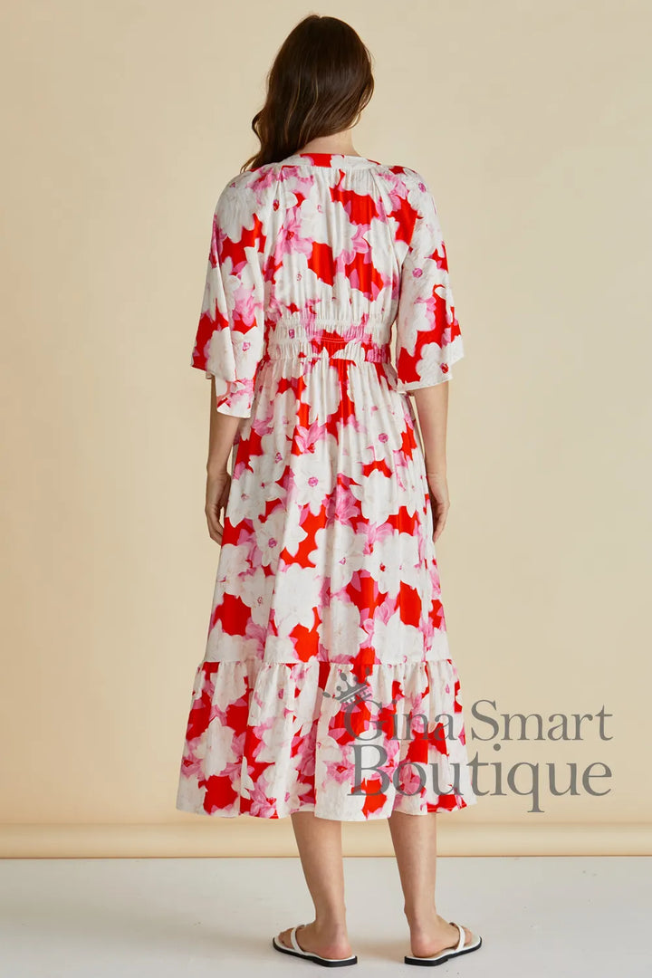Betty Basics Moxie Dress back view red a pink abstract floral midi dress with flutter sleeves and smoked waist - available at Gina Smart Boutique