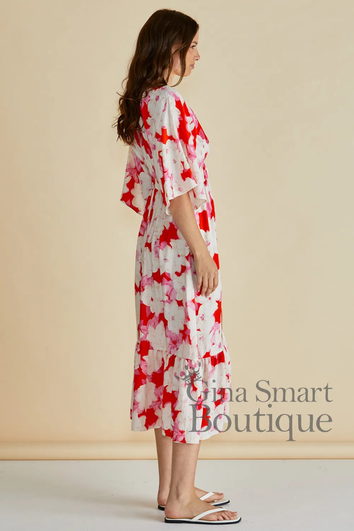 Betty Basics Moxie Dress side view red a pink abstract floral midi dress with flutter sleeves and smoked waist - available at Gina Smart Boutique