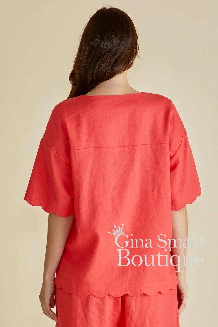 Betty Basics Scarlett Tangerine Shirt back view is a button down V-neck top with a scalloped hem.  Available from Gina Smart Boutique.