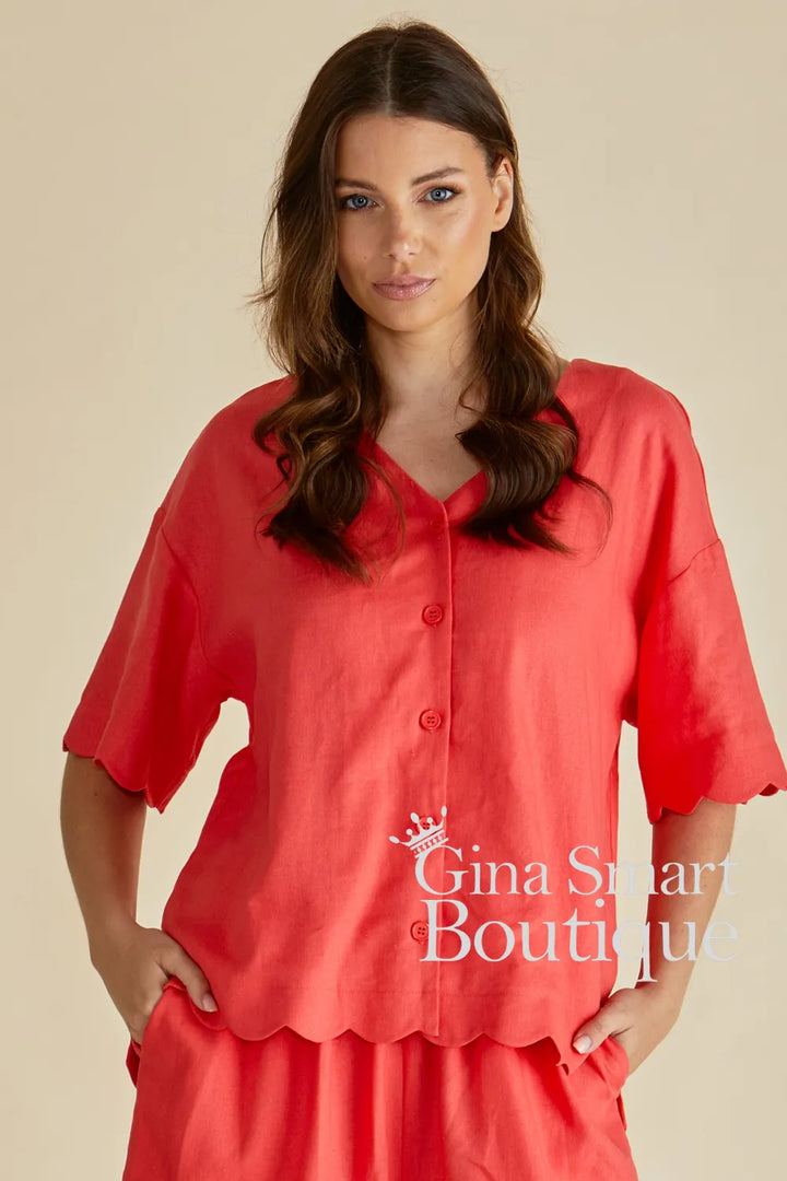 Betty Basics Scarlett Tangerine Shirt is a button down V-neck top with a scalloped hem.  Available from Gina Smart Boutique.
