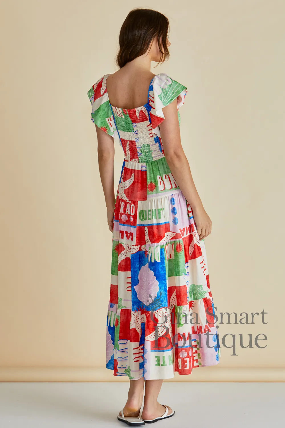 Betty Basics Sea Sadie Dress rear view Betty Basics Sea Sadie Dress multi coloured midi dress with starfish graphics and flutter sleeves available from Gina Smart Boutique