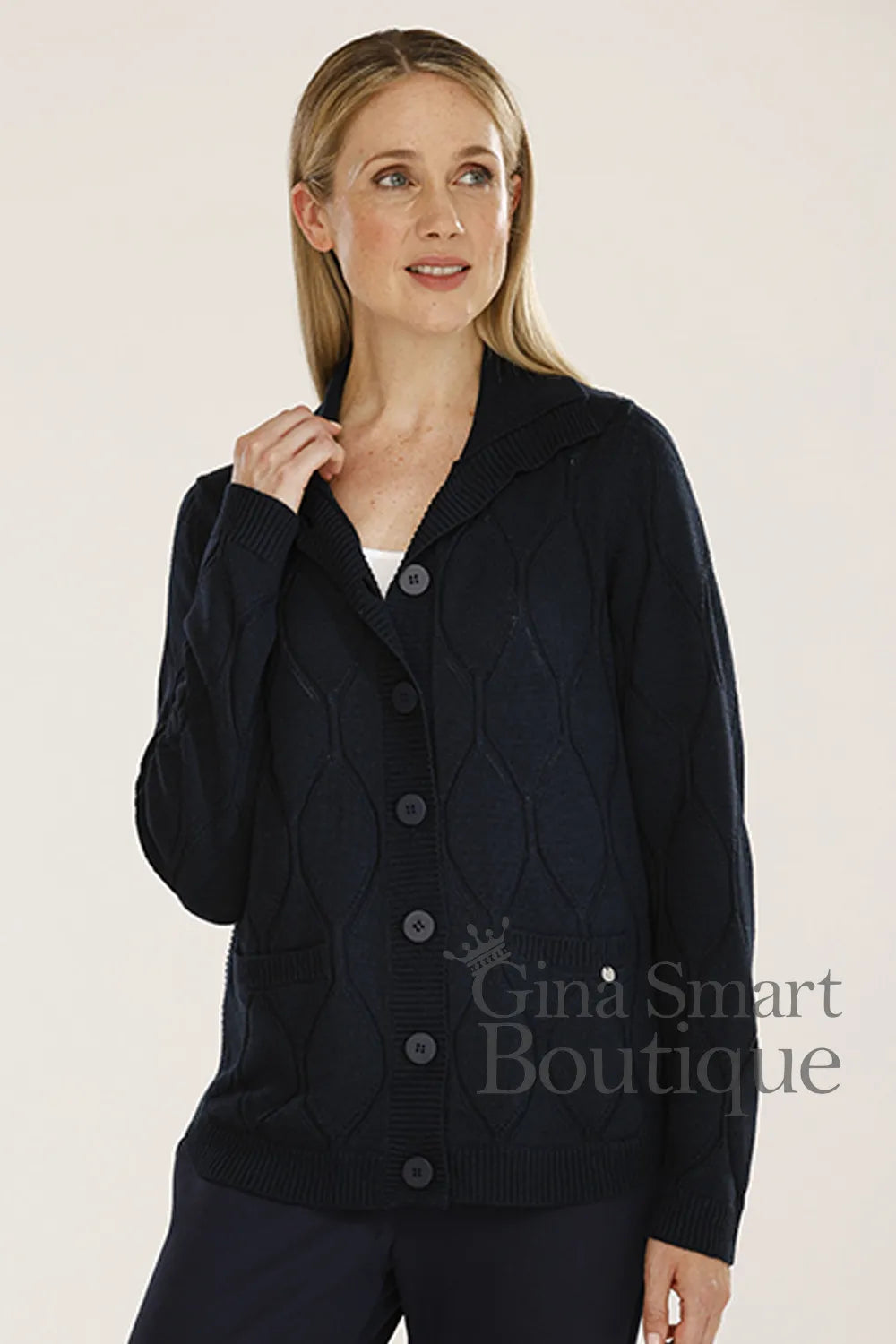 Gollehaug Navy Cardigan is a button down cardigan featuring a notched collar, large tonal buttons and ribbed cuffs.  Available at Gina Smart Boutique.
