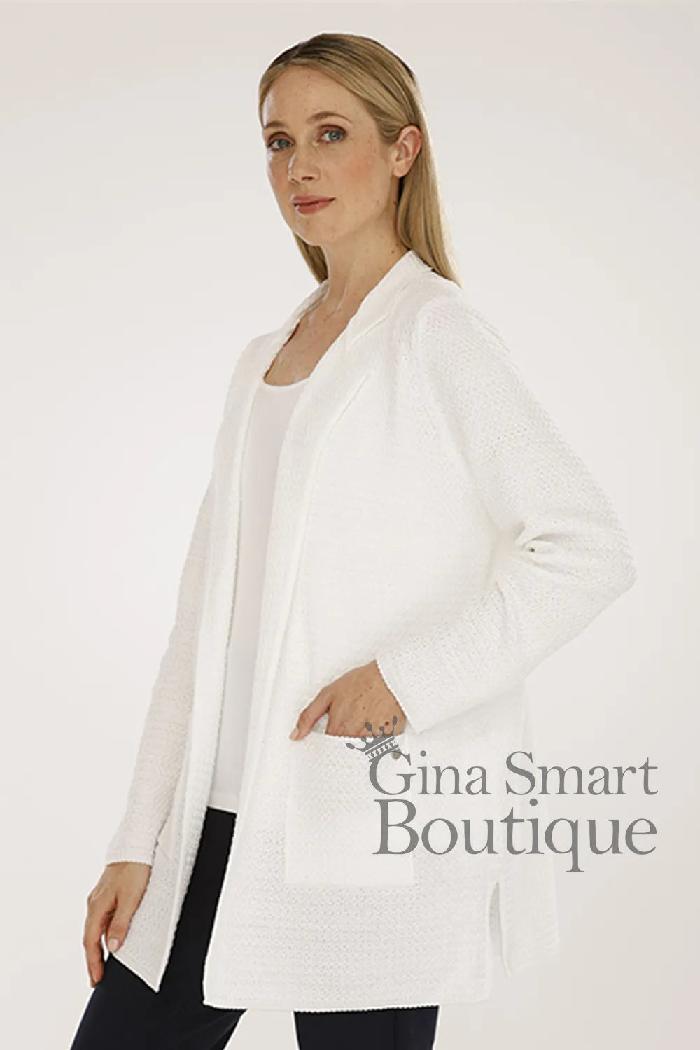 Gollehaug Cream Cardigan is open fronted featuring functional front patch pockets with a relaxed silhouette.  Available from Gina Smart Boutique.
