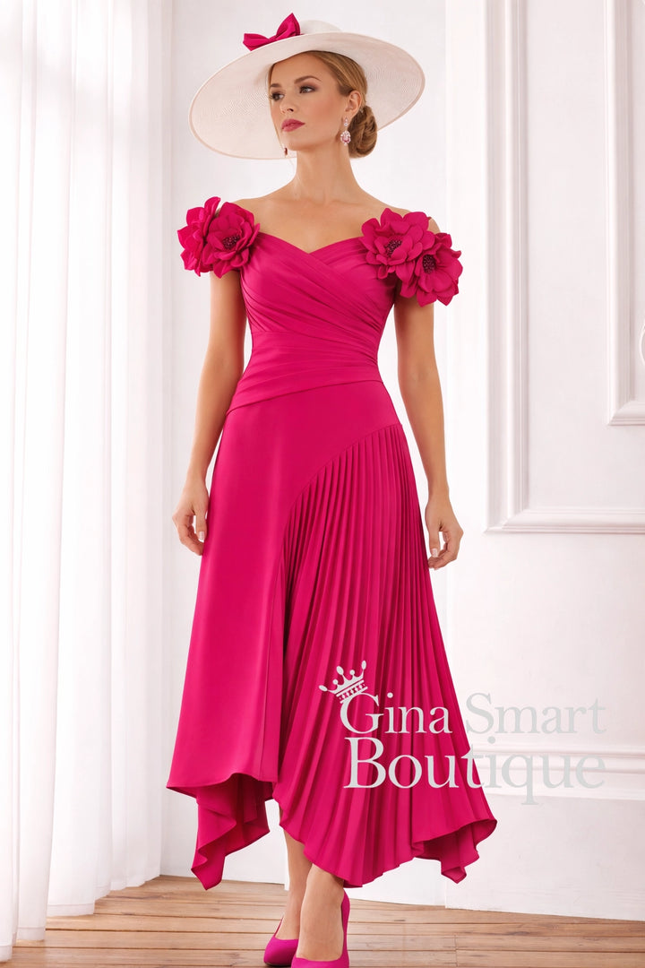 John Charles ruby pink off-the-shoulder dress with 3D floral sleeves, asymmetric pleated skirt, and matching hat – statement Mother of the Bride outfit.